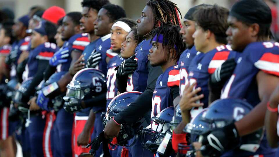 Cypress Springs players stand for the National Anthem before their District 16-6A high school football game against Cypress Ranch held at Cy-Fair FCU Stadium Friday, Sept. 29, 2023 in Cypress, TX.