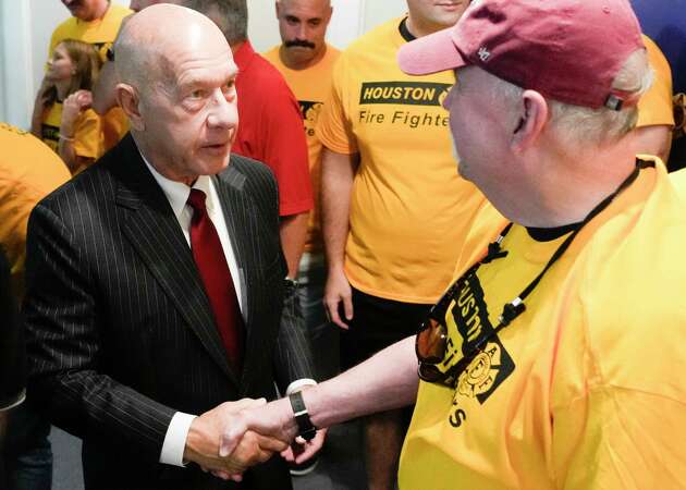 John Whitmire, left, visits with firefighters as the Houston Professional Fire Fighters Association announced its endorsement of him for the Houston mayoral race at UPFFA Union Hall, Saturday, Sept. 29, 2023, in Houston.