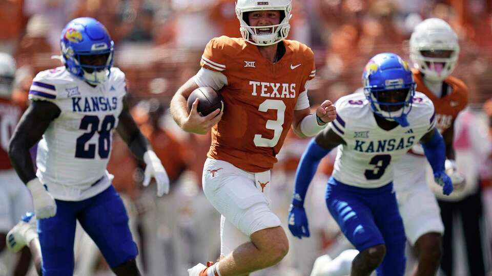 Texas quarterback Quinn Ewers (3) runs for a touchdown against Kansas during the first half of an NCAA college football game in Austin, Texas, Saturday, Sept. 30, 2023. (AP Photo/Eric Gay)