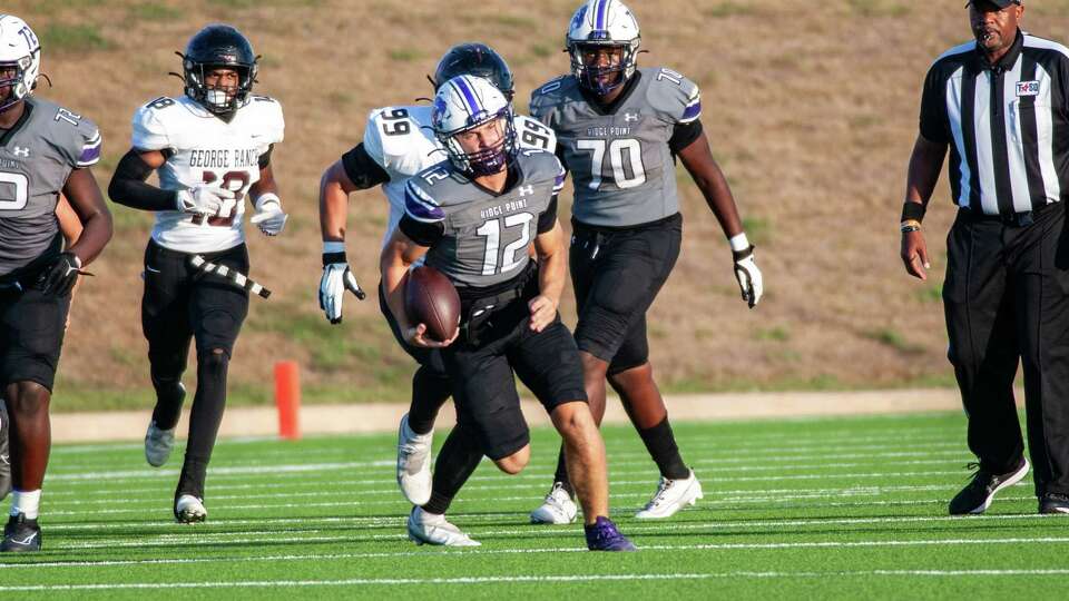 Ridge Point's Austin Carlisle (12) scrambles for yardage against George Ranch in the first half of a high school football game at Mercer Stadium, Saturday, Sep. 30, 2023 in Sugar Land.