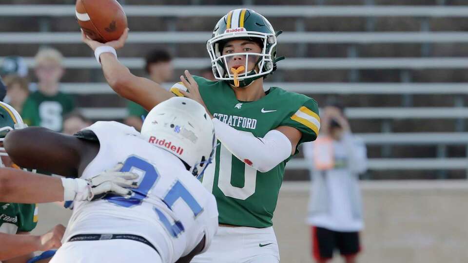 Stratford quarterback Aaron DeLeon, right, passes the ball as Cypress Creek defensive lineman Marion Cook, left, closes in during the first half of their District 17-6A high school football game held at Tully Stadium Saturday, Sept. 30, 2023 in Houston.