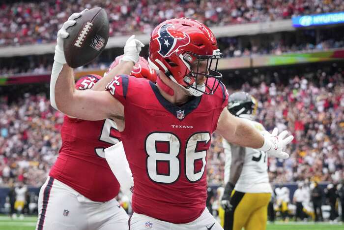 Danny Amendola of the Houston Texans leaps over Javelin Guidry of the