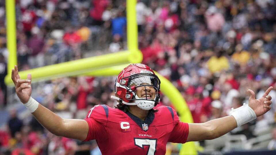 Houston Texans quarterback C.J. Stroud (7) celebrates after the threw a pass to wide receiver Nico Collins (12) who scored a touchdown on the play during the second half of an NFL game Sunday, Oct. 1, 2023, at NRG Stadium in Houston.