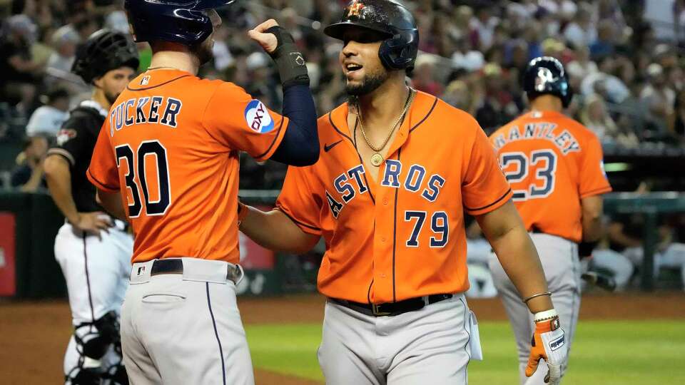 Houston Astros Jose Abreu (79) celebrates his two-run home run with Kyle Tucker (30) during the seventh inning of a MLB baseball game at Chase Field on Sunday, Oct. 1, 2023 in Phoenix.