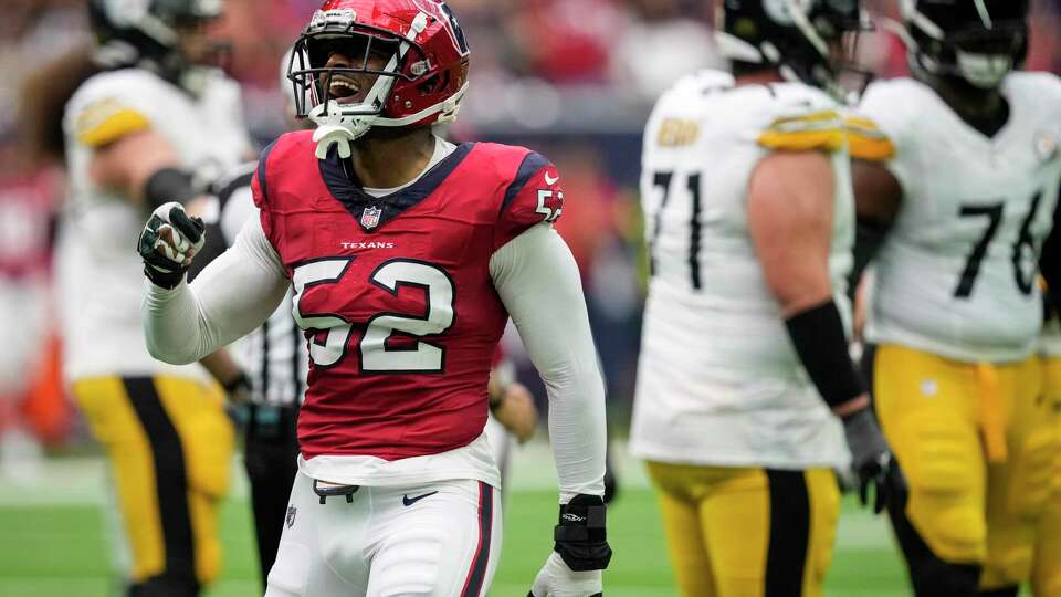 Houston Texans defensive end Jonathan Greenard (52) celebrates after sacking Pittsburgh Steelers quarterback Kenny Pickett during the first half an NFL football game Sunday, Oct. 1, 2023, in Houston.