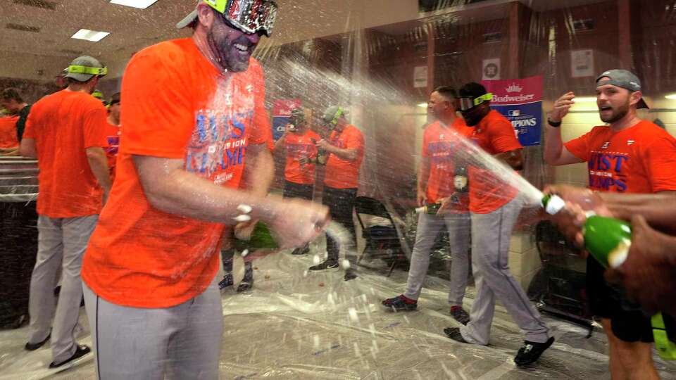 Houston Astros pitcher Justin Verlander celebrates in the clubhouse after clinching the AL West title in an 8-1 win against the Arizona Diamondbacks during a MLB baseball game at Chase Field on Sunday, Oct. 1, 2023 in Phoenix.