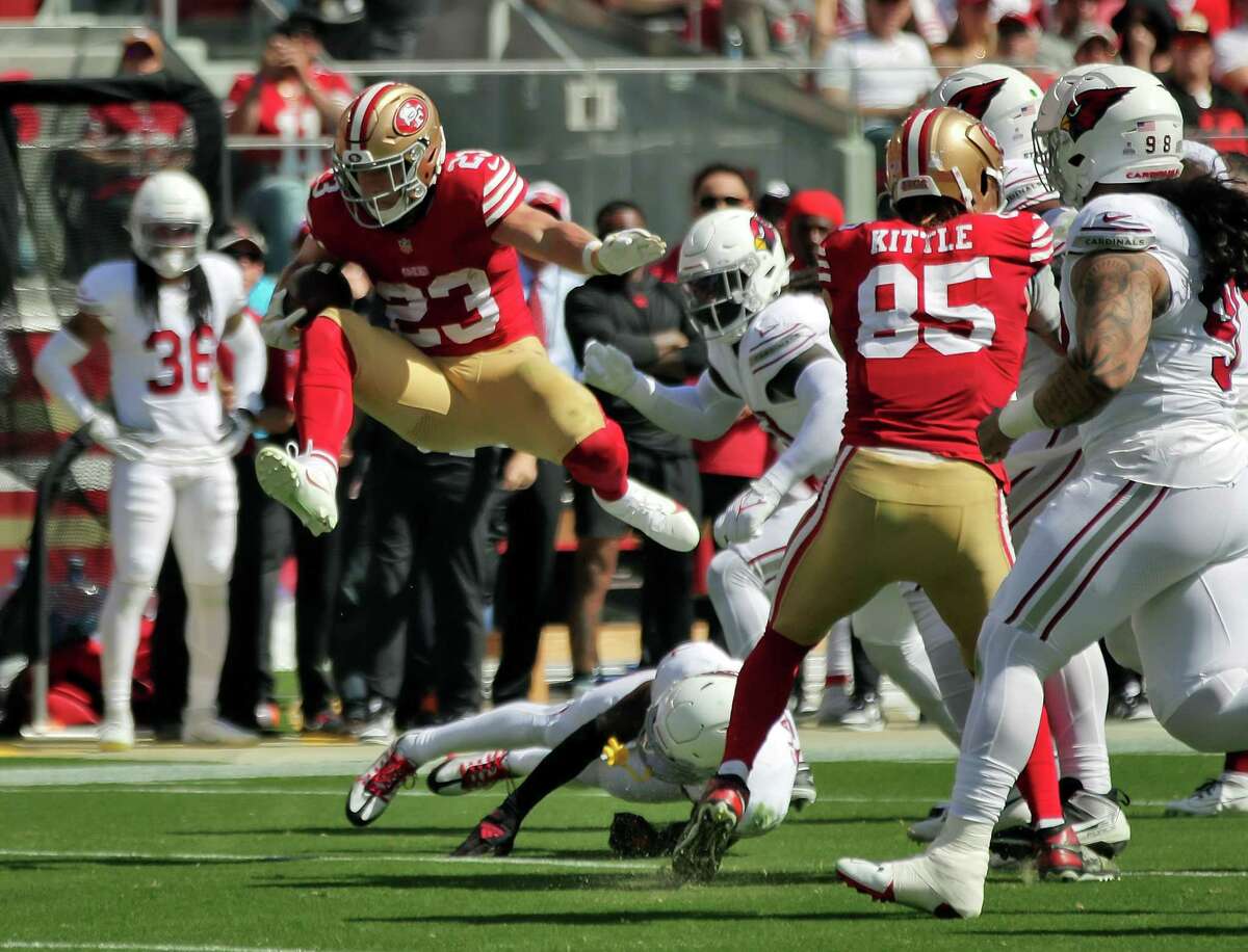 Christian McCaffrey Hurdles Cardinals Defender On the Way to his Second TD