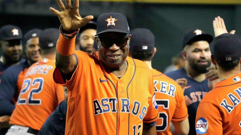 Houston Astros manager Dusty Baker Jr. waves to the fans after clinching the AL West title in an 8-1 win against the Arizona Diamondbacks of a MLB baseball game at Chase Field on Sunday, Oct. 1, 2023 in Phoenix.