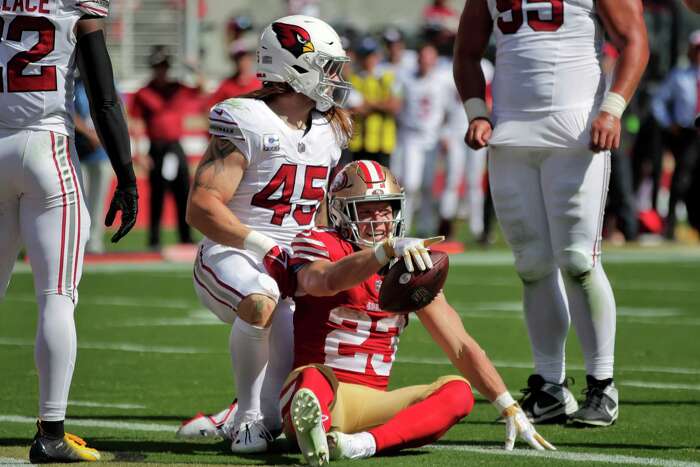 Christian McCaffrey Hurdles Cardinals Defender On the Way to his Second TD