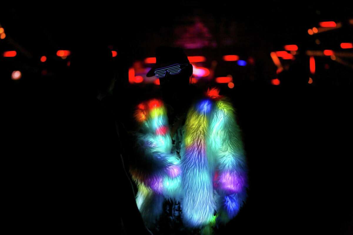 A festivalgoer with a light-up fur coat at Portola Music Festival.