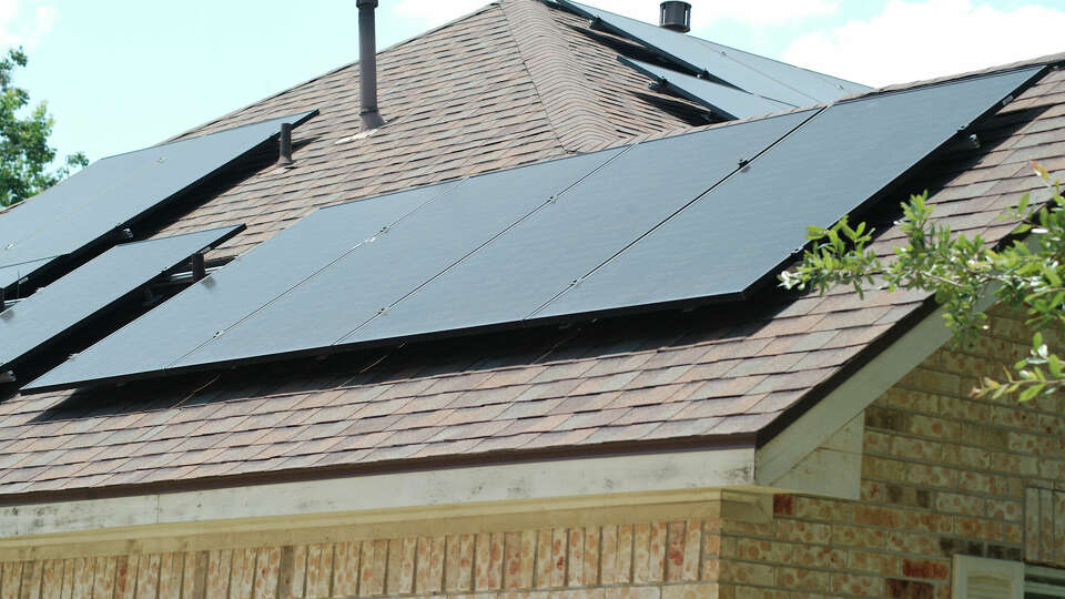 Roof mounted solar panels are visible on a residential home in League City, Wednesday, June 28, 2023. Sunnova Energy has secured a $3 billion deal with the U.S. Department of Energy to make rooftop solar and battery storage more accessible to disadvantaged communities. 