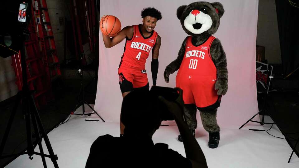 Houston Rockets shooting guard Jalen Green (4) poses alongside Clutch the mascot during media day at Toyota Center, Monday, Oct. 1, 2023, in Houston.