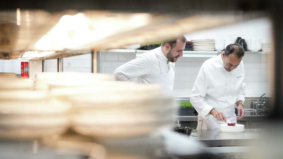 Felipe Botero, chef de cuisine, left, and Alain Alain Verzeroli, culinary director, prepare a beetroot salad Wednesday, Sept. 13, 2023, at Le Jardinier at the Museum of Fine Arts, Houston, in Houston.