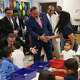U.S. Secretary of Education Miguel Cardona, center, tours a pre-k classroom at Mark Twain Dual Language Academy with SAISD Supt. Jaime Aquino, Wednesday, Oct.4, 2023. San Antonio ISD trustees are debating what type of a leader they will replace Aquino with when he retires in January.