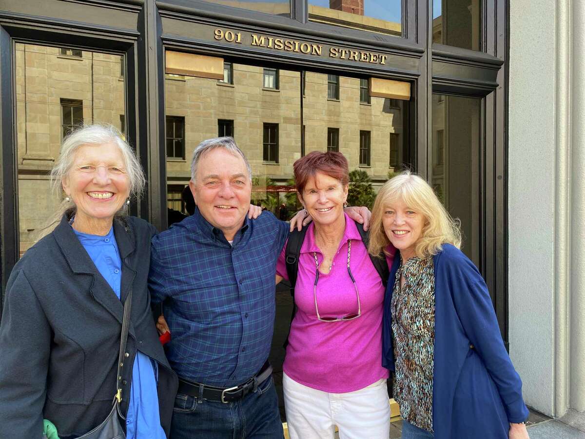 Kevin Fisher-Paulson, second from left, stands outside the San Francisco Chronicle entrance at 901 Mission St. with (from left) Leah Garchik, Adair Lara and Nanette Asimov.