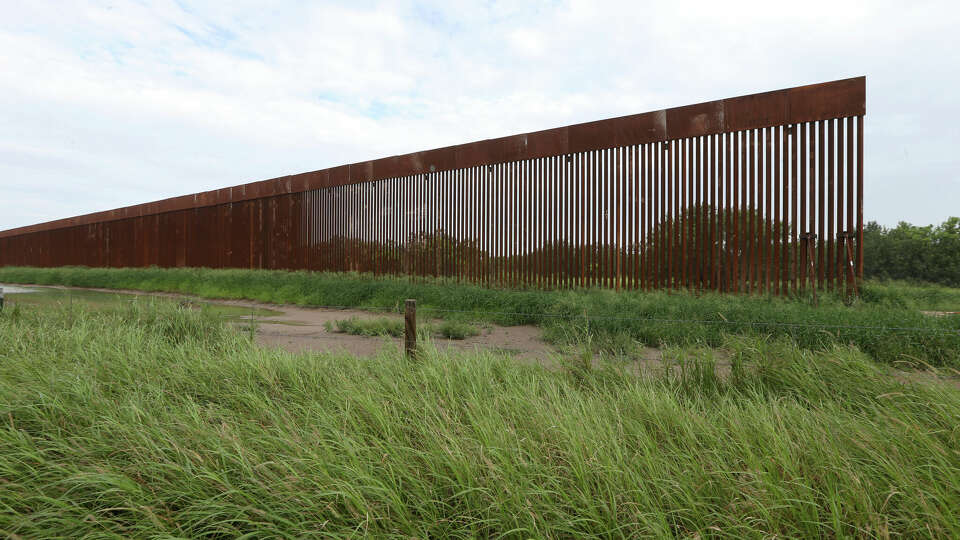 FILE - A border wall section stands on July 14, 2021, near La Grulla, Texas, in Starr County. On Wednesday, Oct. 4, 2023, the Biden administration announced that they waived 26 federal laws in South Texas to allow border wall construction, marking the administration's first use of a sweeping executive power employed often during the Trump presidency. The Department of Homeland Security posted the announcement with few details outlining the construction in Starr County, Texas. (Delcia Lopez/The Monitor via AP, File)