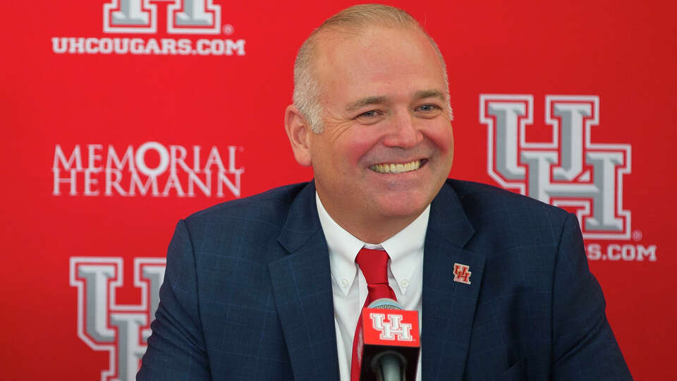 New University of Houston athletic director Chris Pezman listens to questions during an introductory press conference with board chairman Tilman Fertitta and university chancellor Renu Khator at TDECU Stadium, Tuesday, Dec. 12, 2017, in Houston. ( Mark Mulligan / Houston Chronicle )