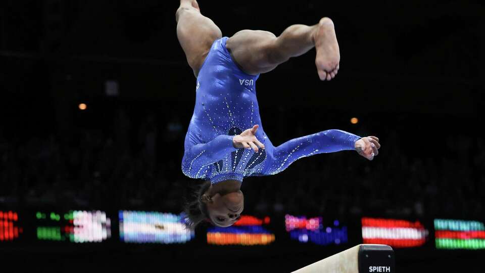 United States' Simone Biles competes on the beam during the women's all-round final at the Artistic Gymnastics World Championships in Antwerp, Belgium, Friday, Oct. 6, 2023. (AP Photo/Geert vanden Wijngaert)