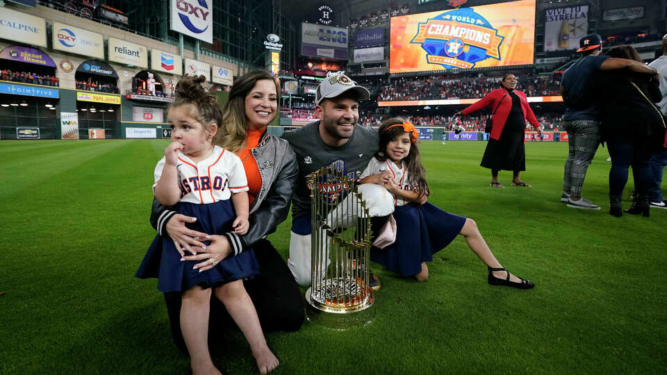 Houston Astros second baseman Jose Altuve poses with his family after the The Houston Astros won 4-1 against the Philadelphia Phillies in Game 6 on Saturday, Nov. 5, 2022, in Houston. (AP Photo/Tony Gutierrez)