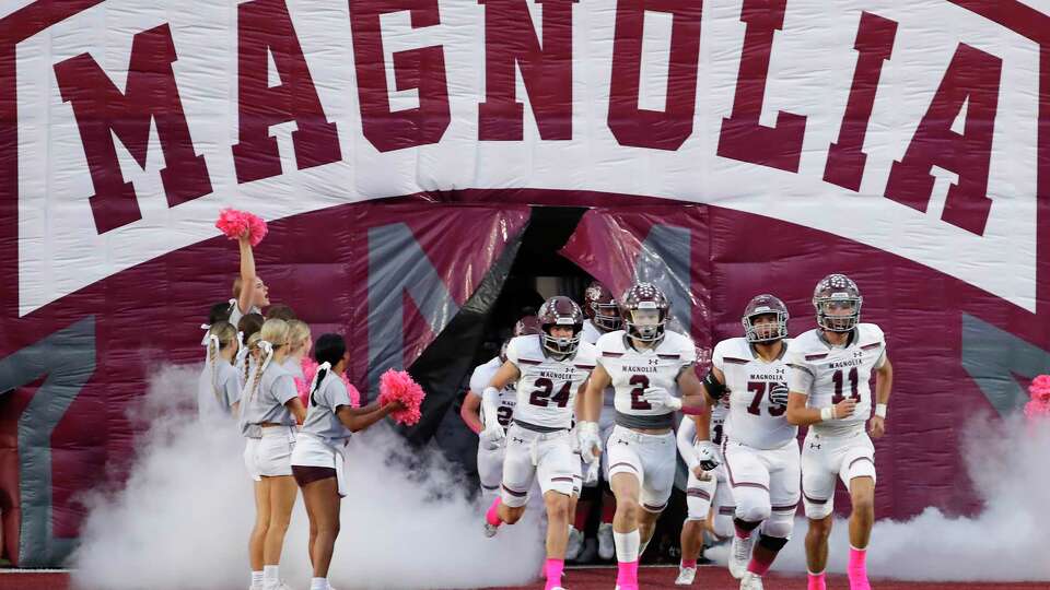 Magnolia players take the field through their tunnel before their District 10-5A high school football game against Magnolia West held at Mustang Stadium Friday, Oct. 6, 2023 in Magnolia, TX.