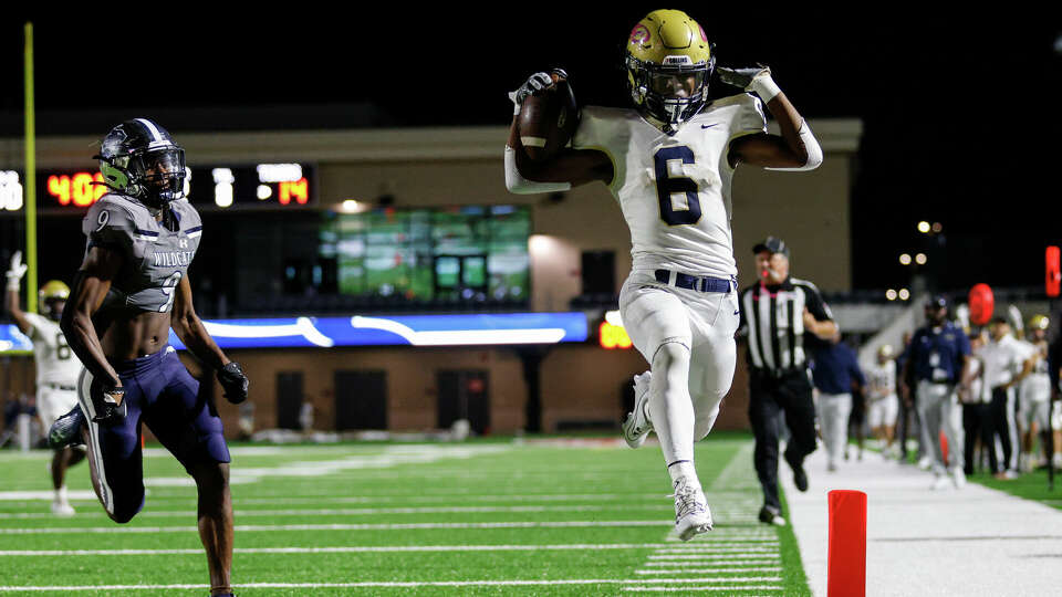 Klein Collins Tigers running back Michael Wilson (6) rushes for a touchdown pursued by Tomball Memorial Wildcats defensive back Nyle Hughes (9) during the high school football game between the Klein Collins Tigers and the Tomball Memorial Wildcats at Tomball ISD Stadium in Tomball, TX on Friday October 6, 2023. Klein Collins leads Tomball Memorial 21-14 at halftime.