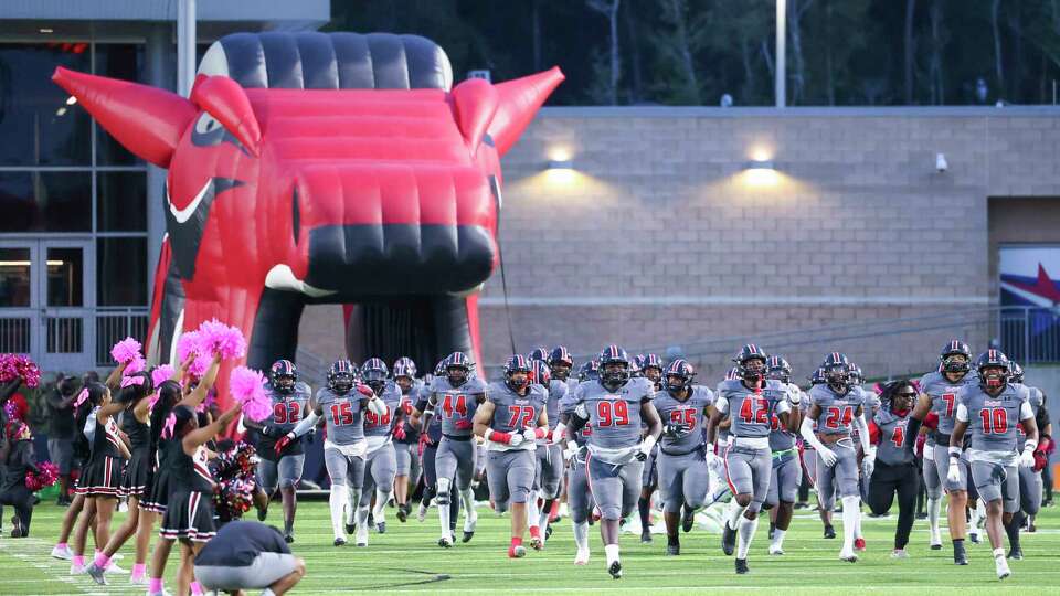 Westfield Mustang players take the field prior to a District 14-6A football game between the Nimitz Cougars and the Westfield Mustangs at Planet Ford Stadium in Spring, TX on Friday, October 6, 2023.