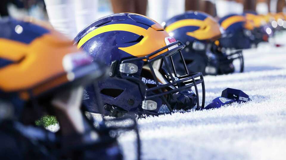 Nimitz Cougars helmets are lined up prior to a District 14-6A football game between the Nimitz Cougars and the Westfield Mustangs at Planet Ford Stadium in Spring, TX on Friday, October 6, 2023.