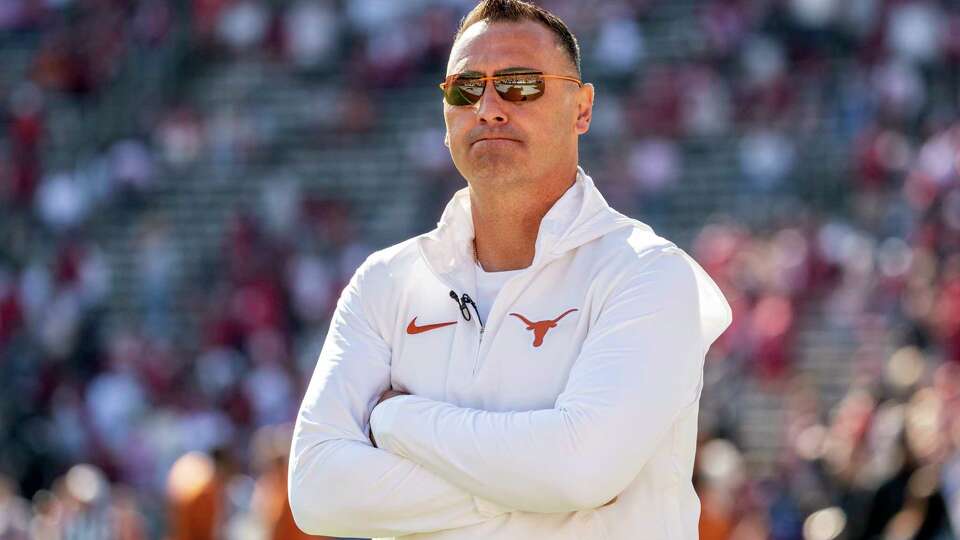 Texas head coach Steve Sarkisian stands on the field before an NCAA college football game against Oklahoma at the Cotton Bowl, Saturday, Oct. 7, 2023, in Dallas. (AP Photo/Jeffrey McWhorter)