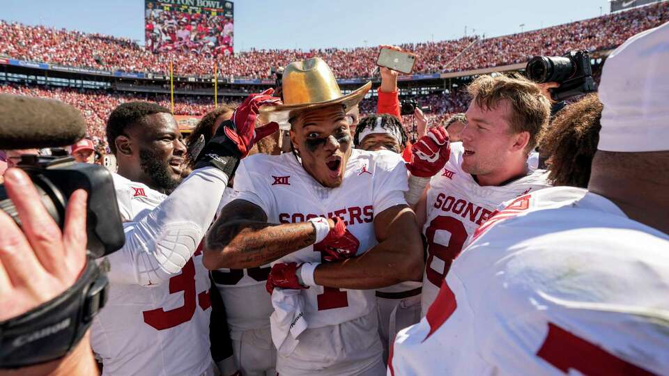 Oklahoma wide receiver Jayden Gibson (1) celebrates with the Golden Hat after defeating Texas 34-30 in an NCAA college football game at the Cotton Bowl, Saturday, Oct. 7, 2023, in Dallas. (AP Photo/Jeffrey McWhorter)