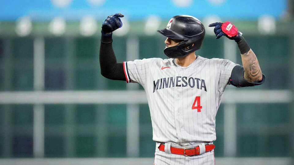 Minnesota Twins shortstop Carlos Correa (4) reacts after hitting a double during the seventh inning of game two of the American League Division Series on Sunday, Oct. 8, 2023, at Minute Maid Park in Houston.