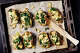 Baked potato skins stuffed with spinach and gorgonzola.
