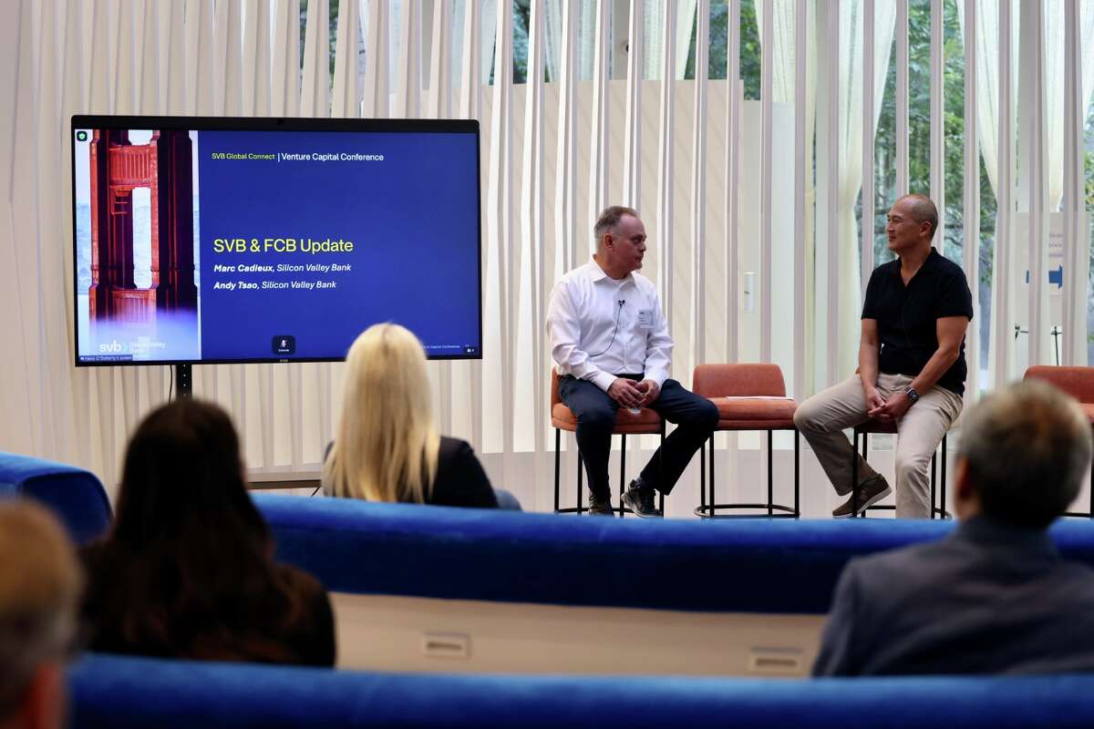 Marc Cadieux, president of SVB Commercial Bank, left, and Andy Tsao, head of global gateway for SVB, converse on stage during the annual SVB Global Connect venture capital conference at the bank’s new venue on Market Street.