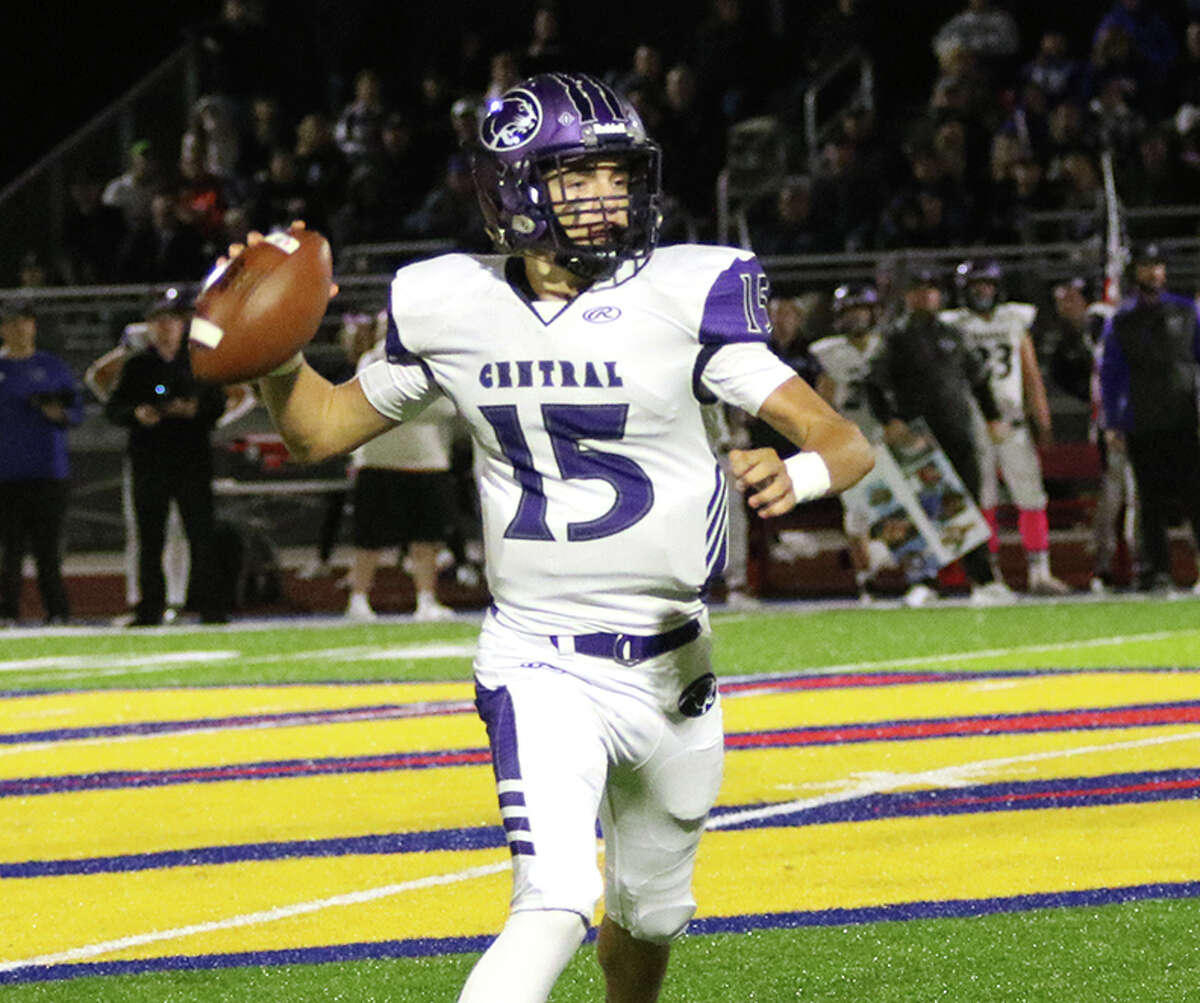 Breese Central quarterback Preston Baker rolls out and throw a pass against Roxana in a Cahokia Conference football game Friday night at Raich Field in Roxana.