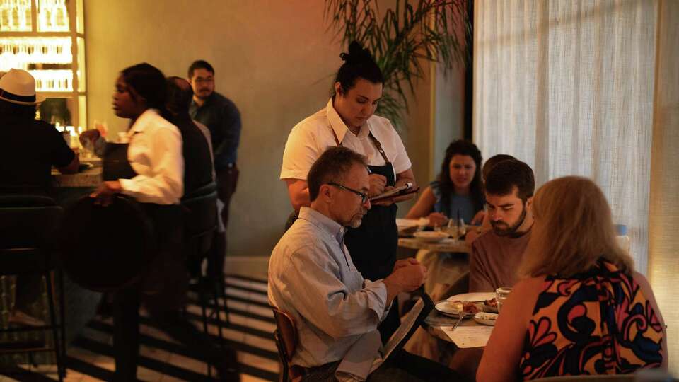 Guests dining at Hamsa located in Rice Village.