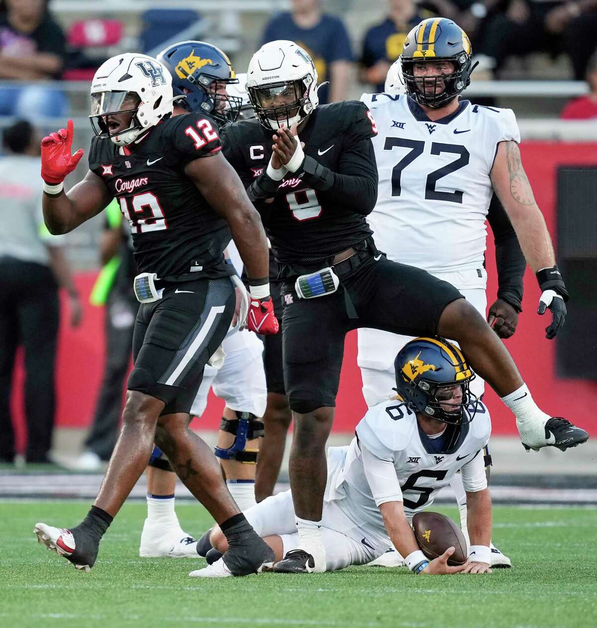 Photographer Tackles Fan Who Ran on Field During College Football Game