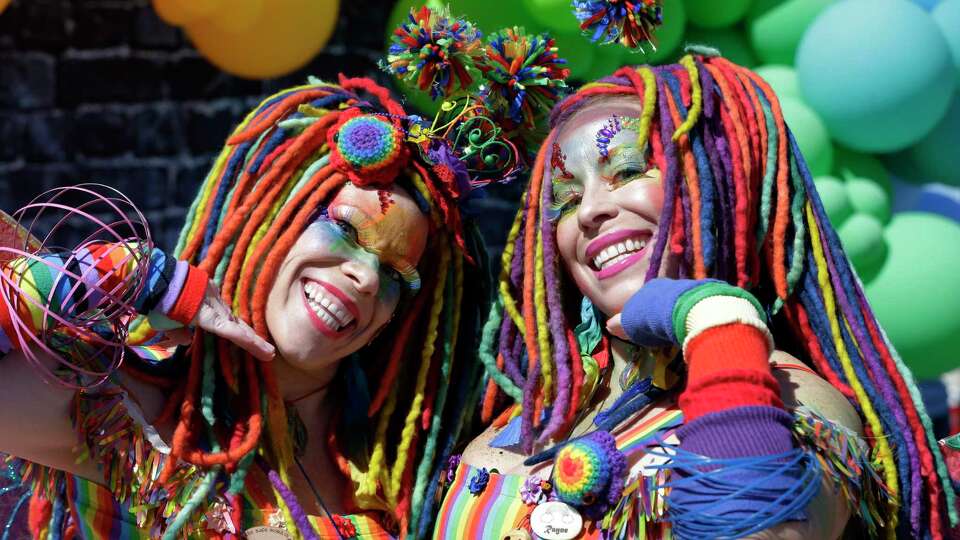 Twin sisters and First Christ Church congregation members Elizabeth Ryall and Rachel Ryall pose in costume during the inaugural Katy Pride Fest held at the church Saturday, Oct. 14, 2023 in Katy, TX.