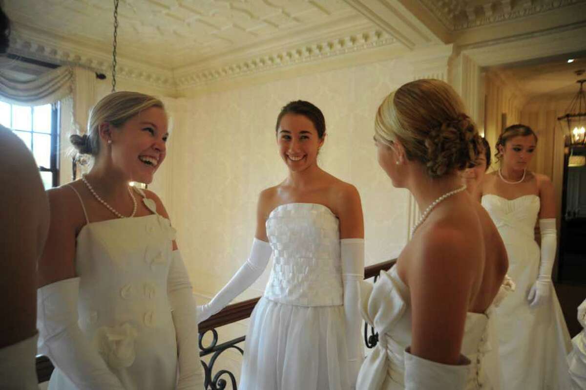 Abby Huth, 16, of Westmister School, left, Jennifer Schwabe, 15, Convent of the Sacred Heart, and Nicole Fischer, 16, Convent of the Sacred Heart about to model cotillion gowns on Sunday, Oct. 24, 2010. Junior League of Greenwich 2011 Cotillion Committee's first event of the season is a 'Presentation of Cotillion Gowns' at an afternoon tea.