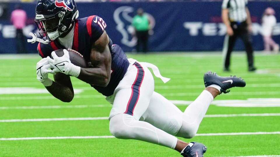 Houston Texans wide receiver Nico Collins (12) catches a pass during the second half an NFL football game Sunday, Oct. 15, 2023, in Houston.