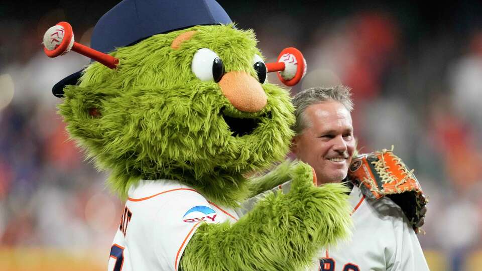 Houston Astros mascot Orbit is seen alongside former Houston Astros and Hall of Famer Craig Biggio before Game 1 of the American League Championship Series at Minute Maid Park on Sunday, Oct. 15, 2023, in Houston.