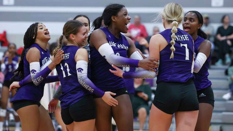 Ridge Point players celebrate a play in the 4th set of a District 20-6A volleyball match between the Ridge Point Panthers and the Austin Bulldogs at Ridge Point High School in Missouri City, TX on Tuesday, October 17, 2023.