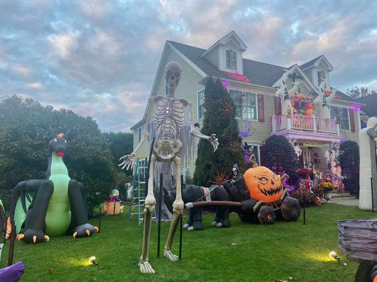 12-foot skeletons tower over CT lawns during Halloween season