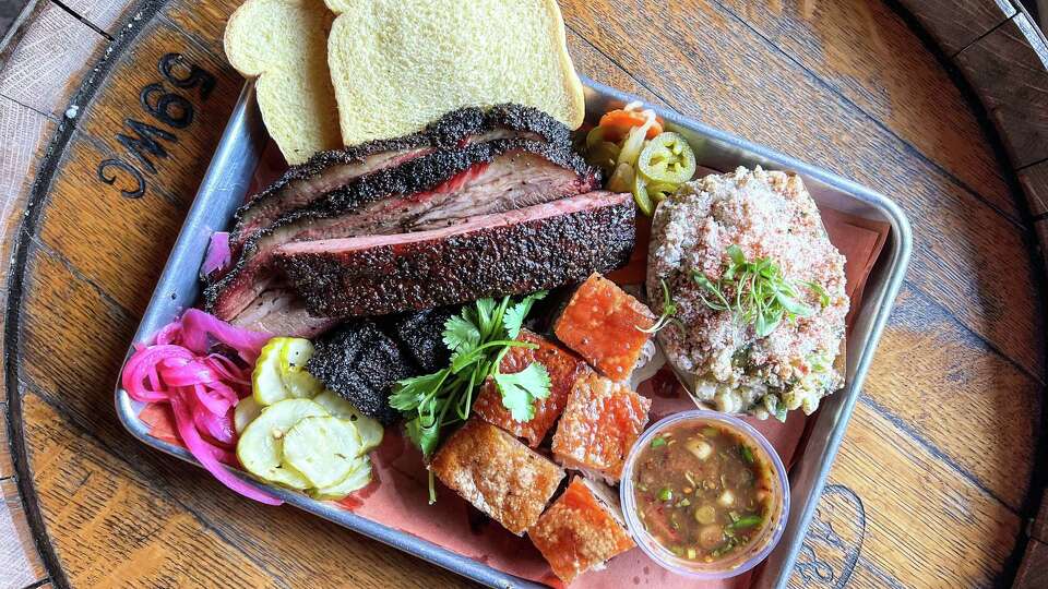 Barbecue tray including crispy pork belly from Hoodoo Brown BBQ, Big Belly Tour, at Moo's Craft Barbecue, Los Angeles CA, Calif.