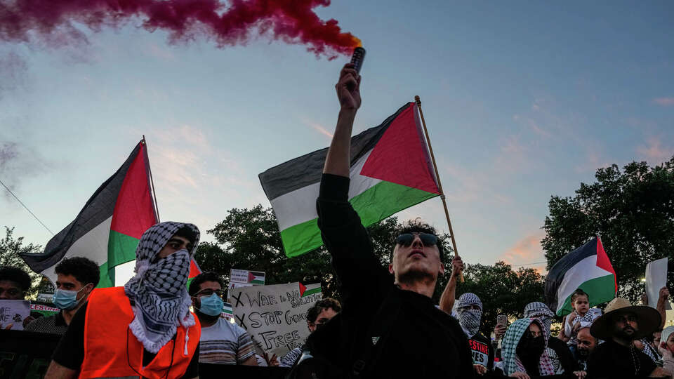 Thousands of people gather outside of the Israeli Embassy to protest Isreal's ongoing attacks on Gaza in the Isreal-Hamas war on Wednesday, Oct. 18, 2023, in Houston.