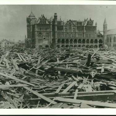 Old Ursuline Convent 1900 - The photograph below shows the Ursuline Convent in Galveston and the scene of destruction around it caused by the 1900 September hurricane in the island city. Loss of life was estimated at between 5000 and 8000. The picture, printed on a glass plate, was taken by J. J. Myers of Galveston. Last week, his widow gave this photograph and several others showing the storm's destruction, to Charles Chipman, above, of Galveston, who is cleaning the 72-year-old camera that took the pictures. The convent was almost destroyed by hurricane Carla in September 1961, and wrecking crews finished leveling it. It is being rebuilt.