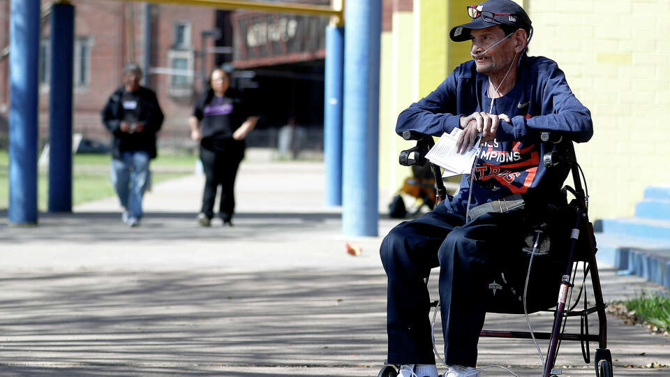 David Robicheaux waits for the election judge on the sidewalk at Marshall Middle School, the Democratic polling place for Precinct 46, Tuesday, March 6, 2018, in Houston. Robicheaux found that the walk from the car was too much for him, and he was allowed to curbside vote from his truck. ( Karen Warren / Houston Chronicle )