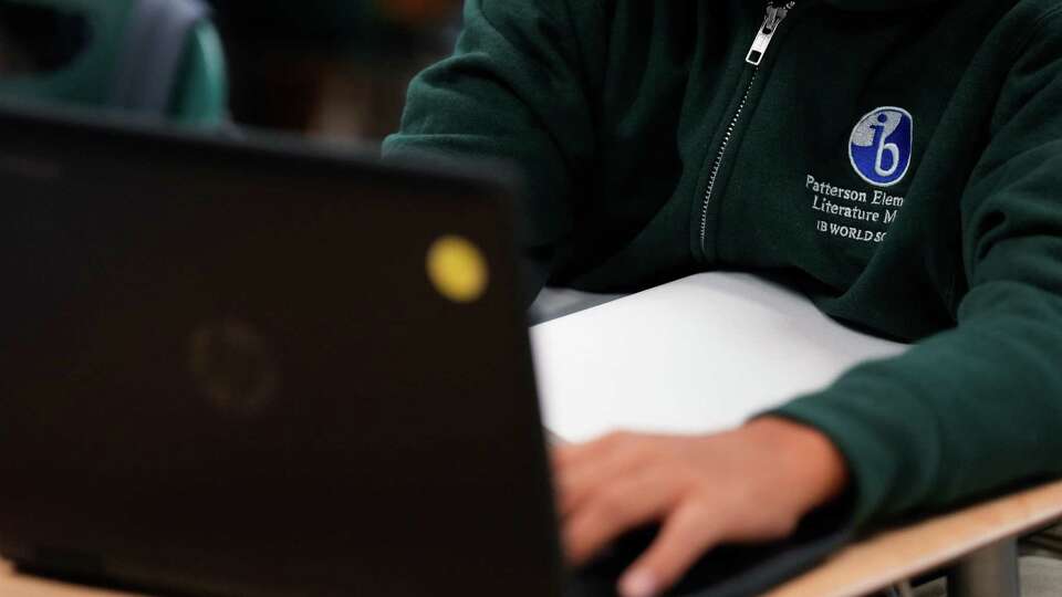 A fifth-grade Dual Language program student doing classwork on Thursday, Oct. 19, 2023 at Patterson Elementary School in Houston.