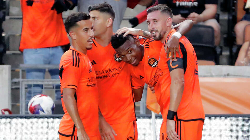 From left, Houston Dynamo midfielder Amine Bassi, defender Franco Escobar, forward Nelson Quinones, and midfielder Hector Herrera, celebrate a goal by Quinones against the Portland Timbers during the first half of an MLS soccer match Sunday, Aug. 20, 2023, in Houston. (AP Photo/Michael Wyke)