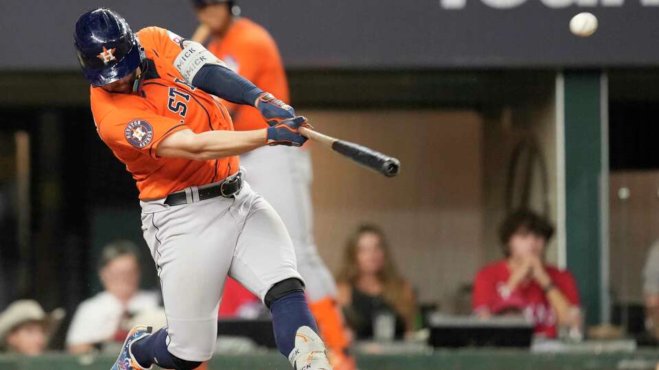 Houston Astros Chas McCormick hits a two-run home run off Texas Rangers relief pitcher Josh Smith in the seventh inning of Game 4 of the American League Championship Series at Globe Life Field on Thursday, Oct. 19, 2023, in Arlington.