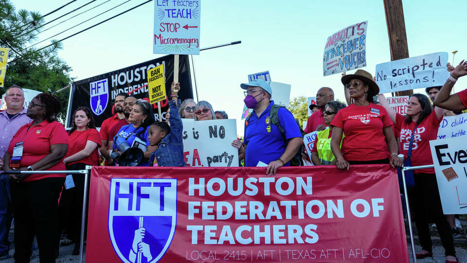 Parents, teachers, students and community members join The Houston Federation of Teachers in protesting the current state of HISD schools in front of HISD headquarters on Friday, Oct. 20, 2023, in Houston.