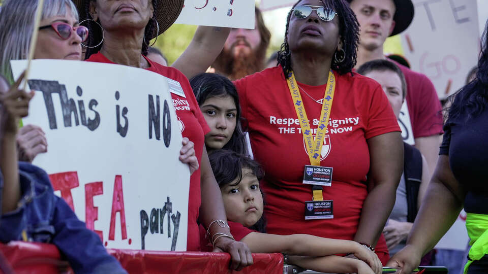 Parents, teachers, students and community members join The Houston Federation of Teachers in protesting the current state of HISD schools in front of HISD headquarters on Friday, Oct. 20, 2023, in Houston.